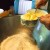 Adding the margarine to the flour. Adding the margarine to the flour.