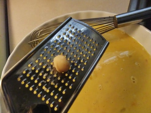 Grate your macadamia nuts into the batter.  Why do I grate them?  It gives the batter flavor without creating a barrier between the bread and the heated butter, which would not allow for even browning.  