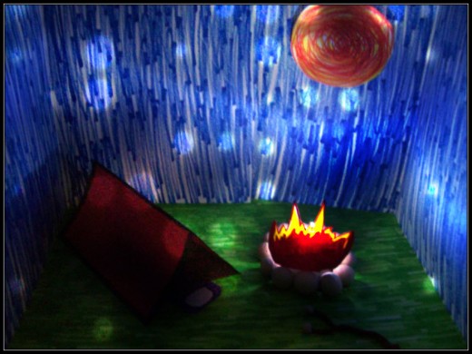 "Fire" by me! Paper, markers, mini light, and clay. Note: can you see the marshmallows on the stick? I'm mighty proud of that! =)