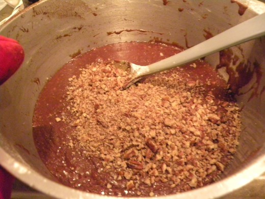 Stirring in the chopped nuts. 