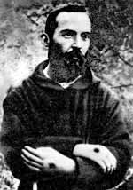 A young St. Padre Pio † bearing the stigmata. 