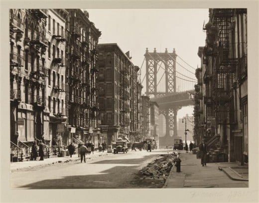 Title: Pike and Henry Streets Date: March 6, 1936 Comments: Pike Street between Henry and Madison Streets, showing tenements with the Manhattan Bridge in the background. 