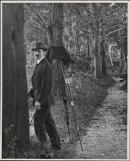 Title: [Photographer with tripod set up in wooded area] Date: 1900 Comments: Photograph of Robert L. Bracklow 