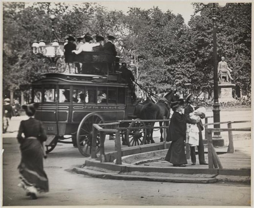 Title: Fifth Avenue Coach at Madison Square Park Date: 1900 Comments: View of Madison Square showing construction and the 5th Ave. omnibus loaded with passengers. 