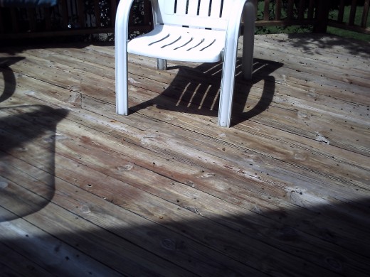 Now it has been powerwashed... but some small patches of old stain did not come off under where the table was and on the stairs