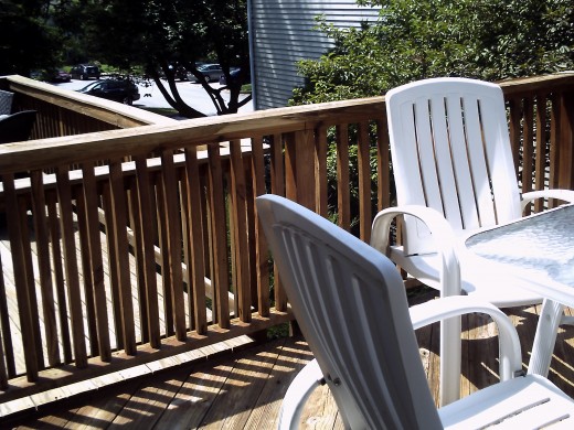 The spindles and rail top are getting old.  We are going to use a solid cedar stain and of course, nails tightened