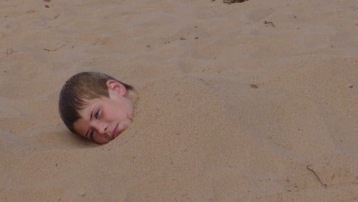 Its always fun to bury your brother in sand at the beach.