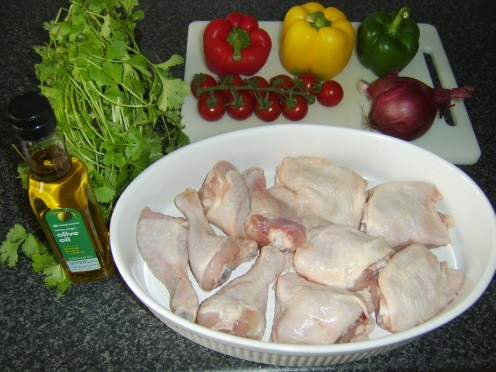 Chicken pieces roasted with an assortment of tasty vegetables in olive oil makes for a delicious evening meal for two