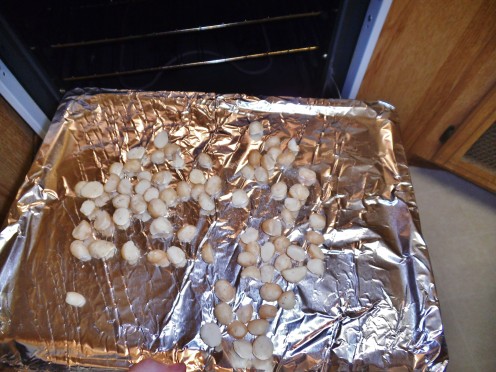 Placing nuts on foil lined baking sheet helps them to toast evenly.