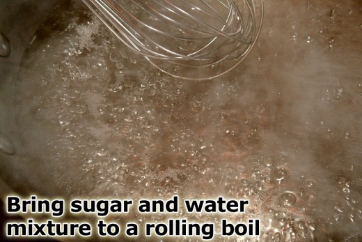 Bring sugar and water to a boil while stirring to make a clear syrup. 