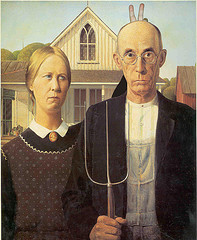 Notice the "rabbit ears," behind the old man in this American classic painting, American Gothic.