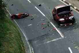 I'll report that darned car soon as I find my head!  (This may have been staged in a safety campaign)
