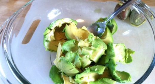 Mash avocado with lime juice and a fork