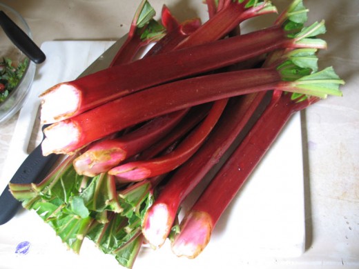 Rhubarb stalks.  Ruby colored, the fruit tastes wonderful when cooked with sugar.  Rhubarb is also delicious when paired with strawberries. 