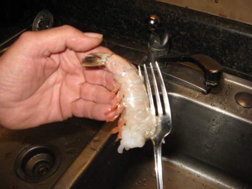 To leave tail on, push the tine to the segment just above the tail.