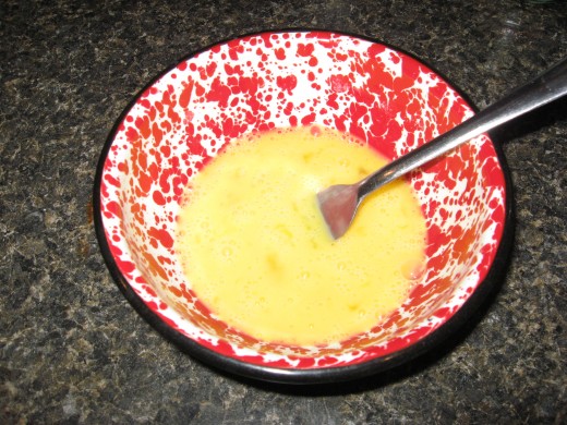 Whisk together eggs and water.