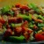Sautéed vegetables on top of the boneless pork loin chops.