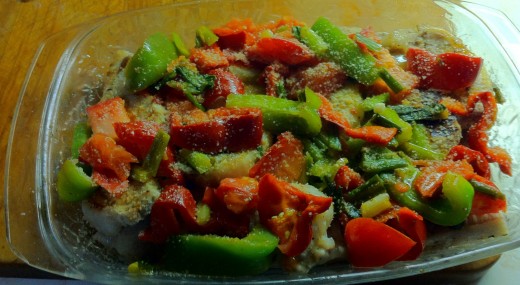 Sautéed vegetables on top of the boneless pork loin chops.