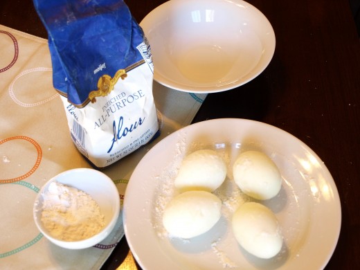 Peel and roll your eggs in flour.