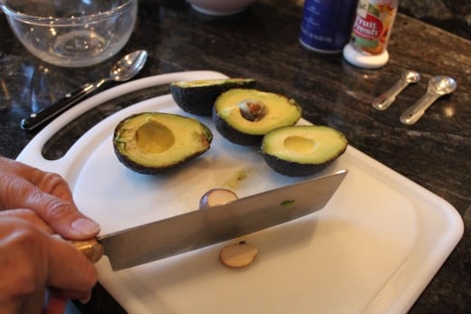 Removing the pit from the knife.