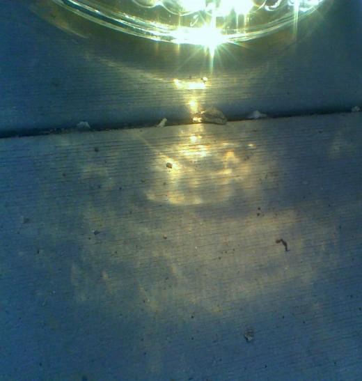 The golden reflection of sun tea on my back patio ~ t's a refreshing compliment to fruit tarts on an early summer evening.
