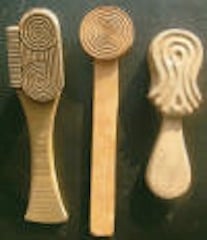 Wooden paddles used in marking pottery