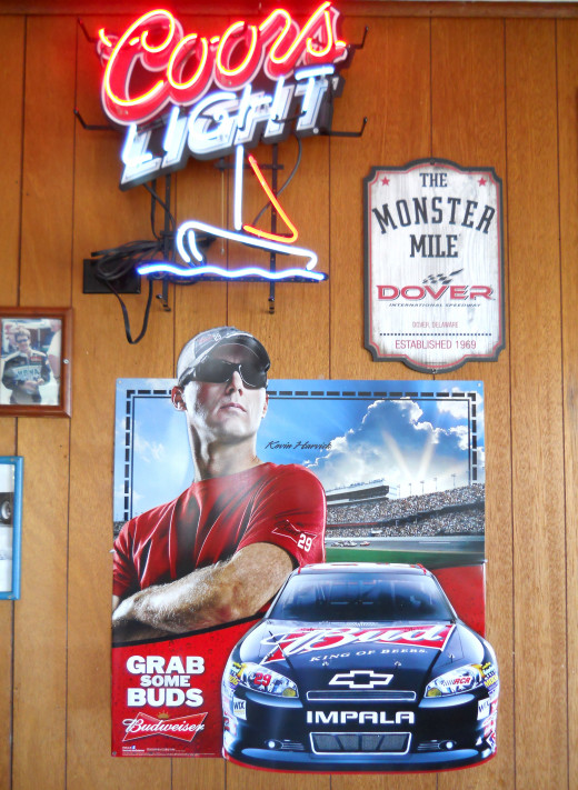Nascar memorabilia in main dining room. Note the vintage paneling on the walls. 