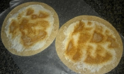 Here are the tortillas with fat free cream cheese and sprinkled with a teaspoon of the sugar, cinnamon, and nutmeg mixture on each.