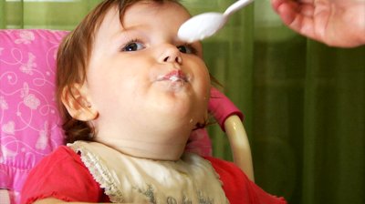 baby eating porridge