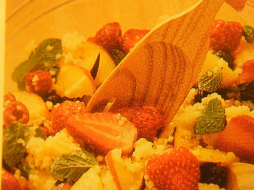 Be sure that all your fruit, couscous, and mint leaves get well coated with the liquids for the best flavor. 