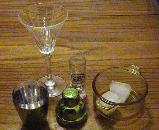 Martini glass, cocktail shaker and ice.