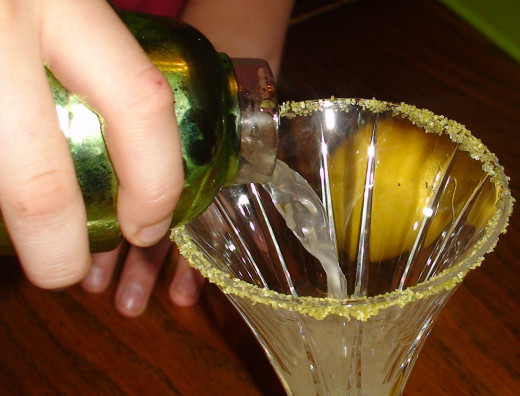 Pour the mixture into the martini glass.