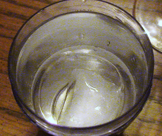 Add ice to the cocktail shaker.