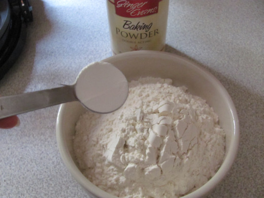 Add your baking powder and salt to the flour and whisk together