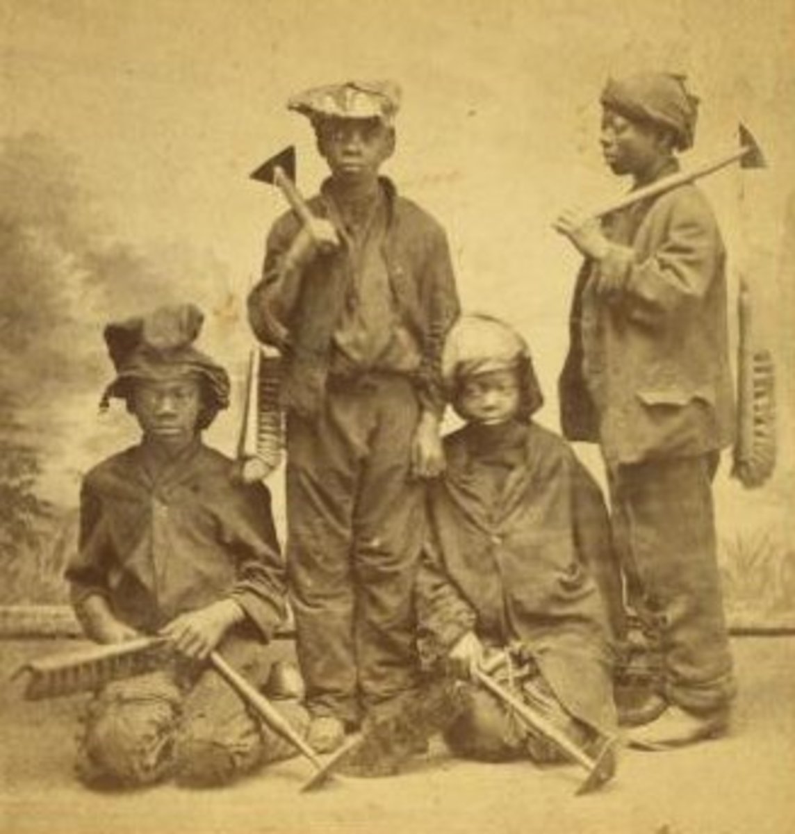 Studio picture of African American child apprentice chimney sweeps by Havens O. Pierre. Taken sometime between 1868 and 1900.