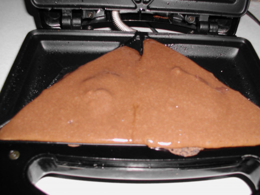 Cover the filling with more batter. Close the lid and cook 5 minutes