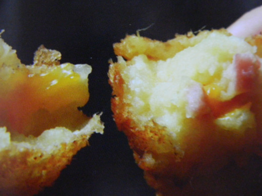 Piping hot potato croquettes with ham and cheese filling 