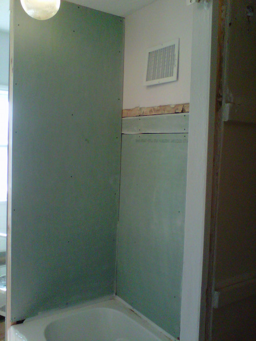 Here's the roughed in wall before the shower enclosure was put up--note that it didn't have to be perfect, as it would be covered by the enclosure.