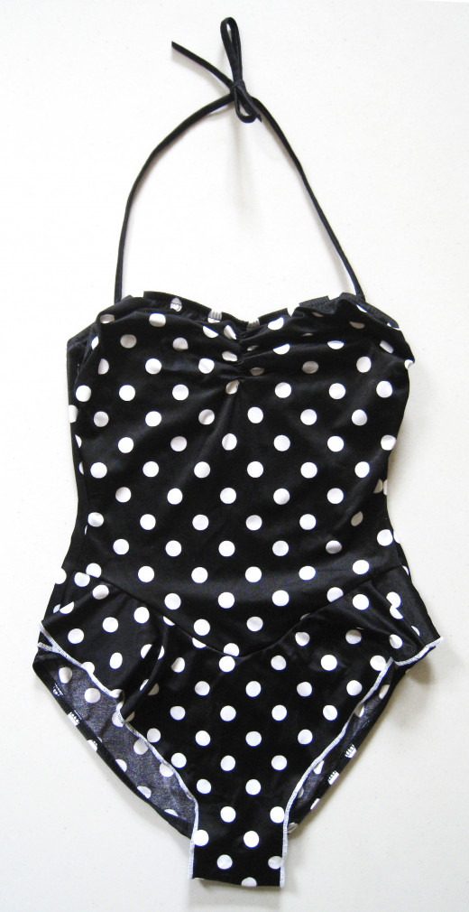 Something like a bathing suit, with nylon and  lycra spandex will have some stretch. Vintage polka dot one piece swimsuit from cutandchicvintage.etsy.com