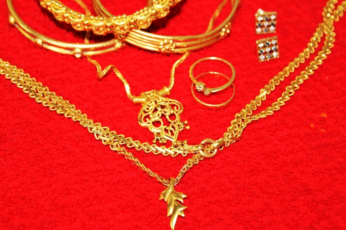 What is a home remedy to clean gold jewelry?