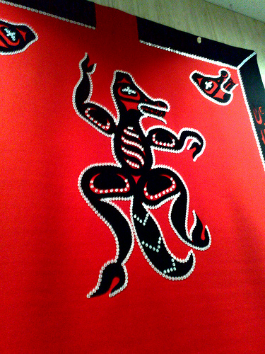 Button blanket featuring Wolf Clan crest, displayed at 2010 Vancouver Winter Olympics in conjunction with Four Host First Nations Pavilion arts.