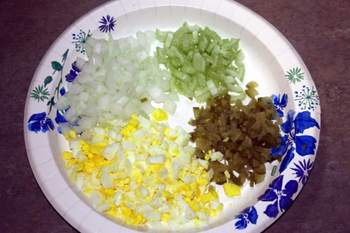 Chopped onion, celery, pickles and boiled eggs.