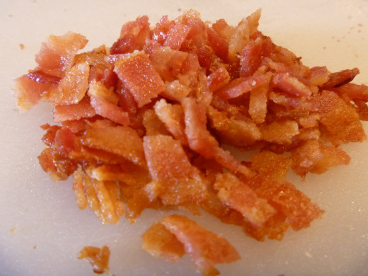 Bacon chopped to match the size of the almonds and cranberries.
