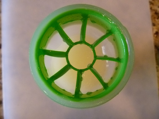 A shaker with an insert like this one works very well to mix the dressing just before serving.