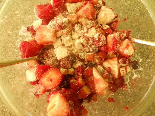 Toss fruit mixture with flour and sugar.