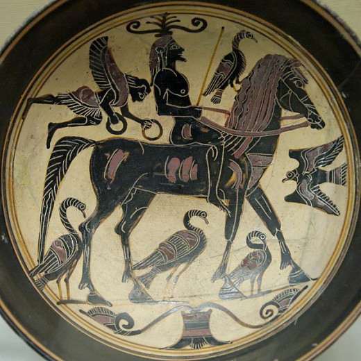 A confident rider, surrounded by birds of good omen is approached by a Nike bearing victor's wreaths on this Laconian black-figured kylix, ca. 550–530 BCE