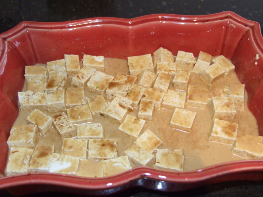 Tofu with the marinade ,already to be baked