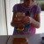 Grace adds the honey to the peanut butter. Grace adds the honey to the peanut butter.