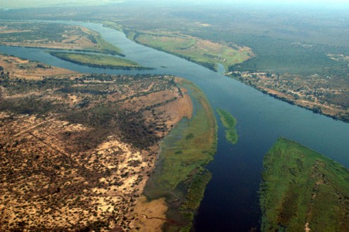 Botswana, Nambia, Zambia, and Zimbabwe. The Zambezi is 2200 miles (3540 km) long. Botswana, Nambia, Zambia, and Zimbabwe. The Zambezi is 2200 miles (3540 km) long.