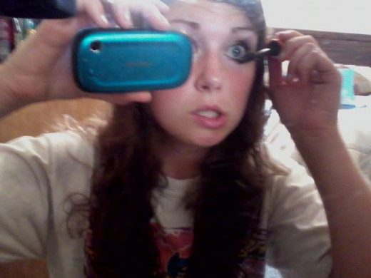 Getting angry trying to take a picture of applying mascara
